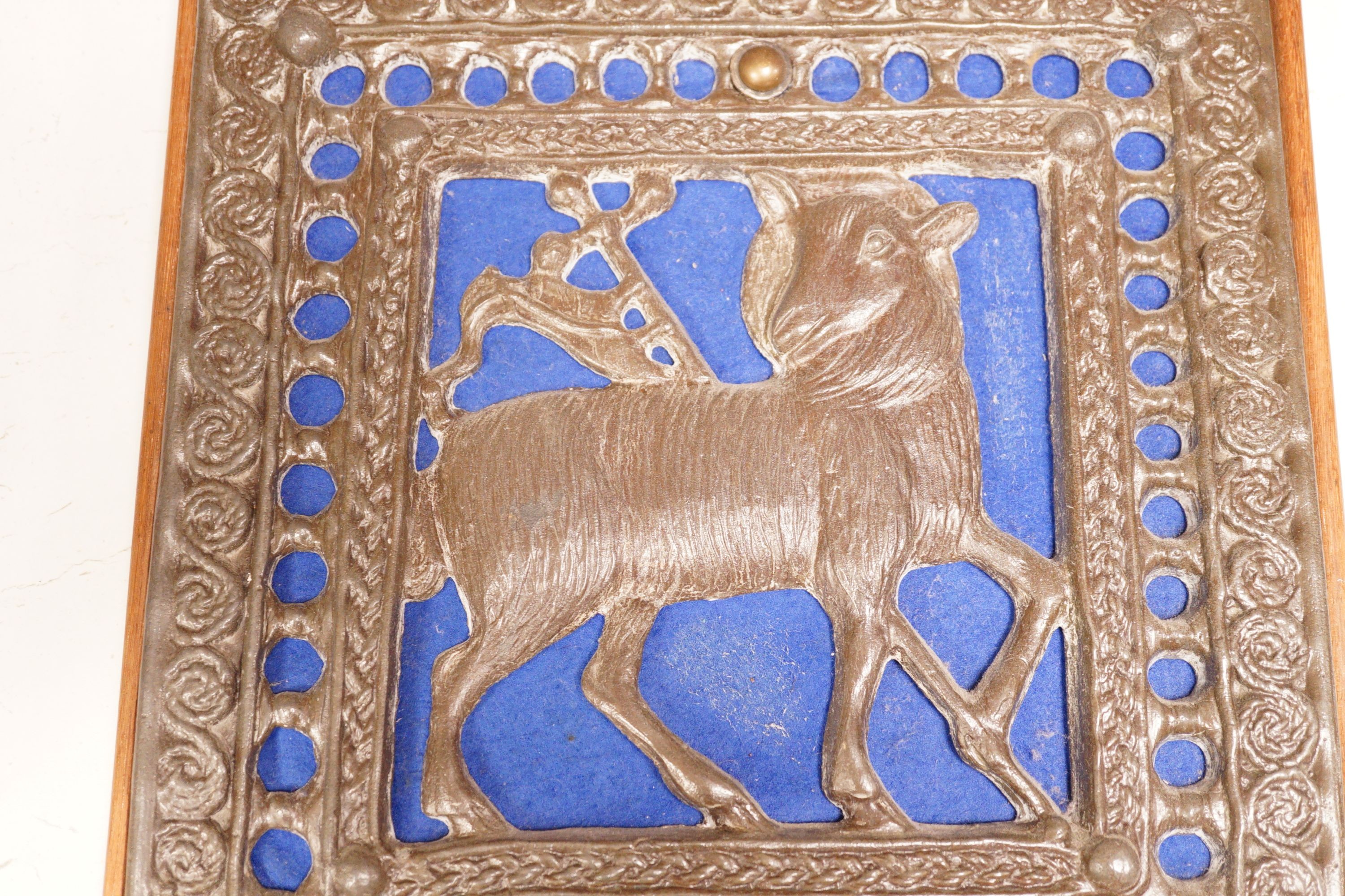 A wall mounted Lamb of God cast metal panel, 31 x 29cm
